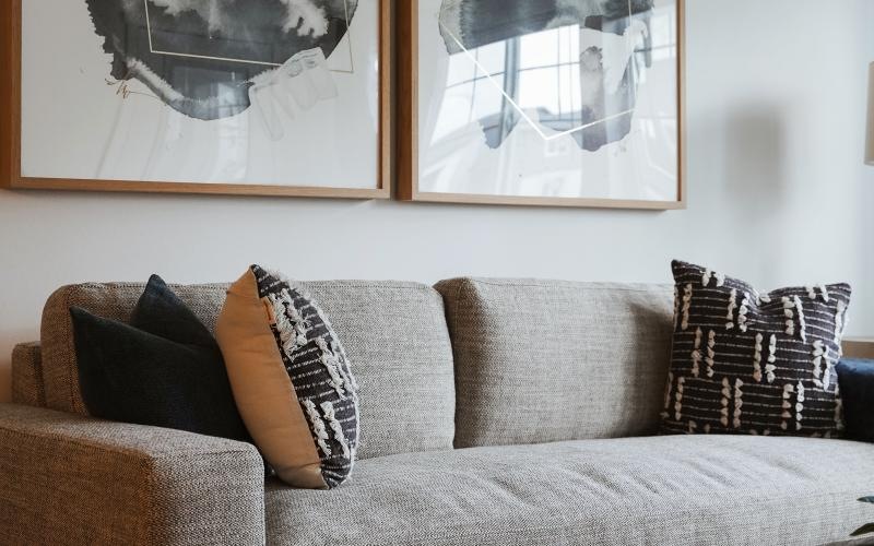 a couch with a painting on the wall